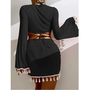 Women's black two-piece beach set featuring long flare sleeves and white fringe trim detail
