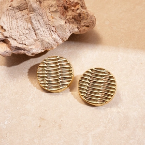 Minimalist golden round acrylic ripple earrings on stone background for a premium look