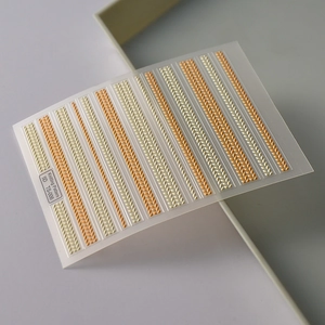 5D embossed nail art stickers with 3D knitting pattern in cream and orange colors