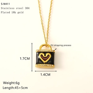 Detail showing heart bag pendant dimensions and 18k gold plated stainless steel specs