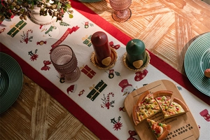 Detailed overhead view of a Christmas table runner featuring snowman and festive holiday patterns