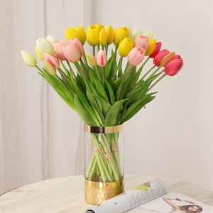 Bouquet of artificial soft glue tulips in multi-colors with a modern glass vase