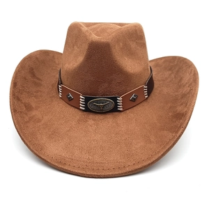 Close-up of brown western cowboy hat featuring a leather band with longhorn metal emblem