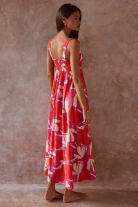 Detail of red and pink floral maxi dress showing the elastic back and flowy fabric