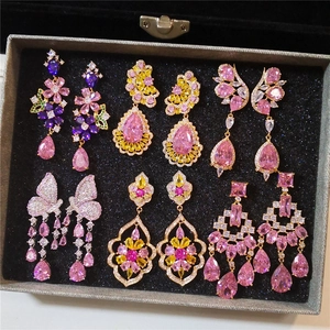 Luxurious rose gold drop earrings set with crystals in heart, butterfly and waterdrop shapes