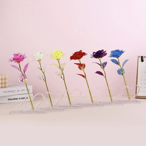 Six colorful gold foil roses in heart-shaped 'love' bases for holiday gift decoration