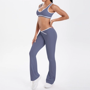 Detail view of smog blue yoga set featuring contrast piping and V-waist flared pants