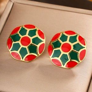 Vintage enamel round earrings in red and green with 18K gold plating on display