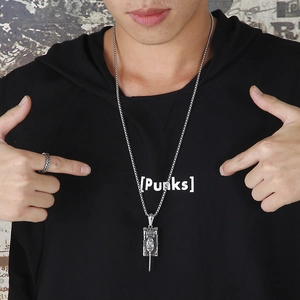 Men's vintage stainless steel tank pendant necklace worn on a black hoodie streetwear style