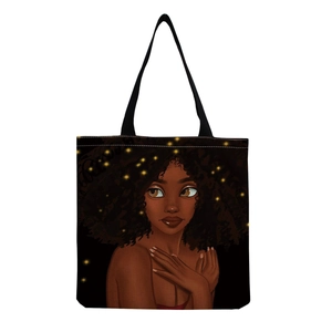 Detailed view of canvas tote bag with black strap and artistic black woman illustration