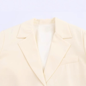 Minimalist long-line beige blazer for women with refined twill texture and single-breasted detail