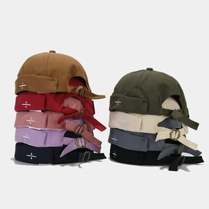 Detailed view of miki hat collection with embroidery and adjustable metal buckle