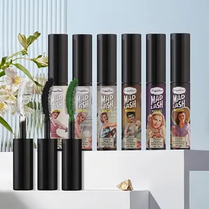 Waterproof colored mascara set with white, black, and green brushes on a white pedestal