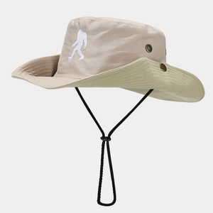 Detail of outdoor sun hat with bigfoot embroidery, breathable eyelets and windproof cord