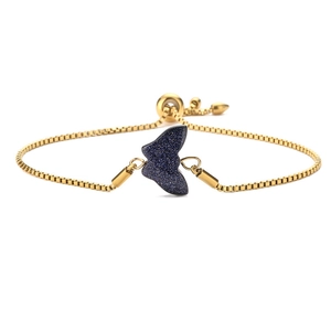Detail of adjustable gold box chain bracelet with blue glitter butterfly pendant