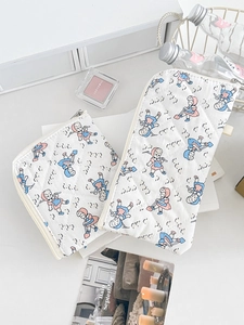 Quilted storage pouch featuring vintage cartoon prints and durable metal zipper closure