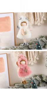 Detail view of plush Christmas angel hanging ornaments with sequin antlers and stars