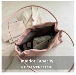 Pink faux leather tote bag with interior view showing large capacity and magnetic closure