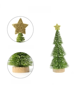Mini Christmas tree detail with golden star topper and natural round wood base