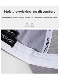 Detail of grey breathable fabric lining with wide white sweatband and reinforced stitching
