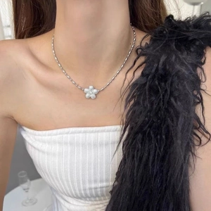 Elegant silver bead chain necklace with white enamel flower pendant and center diamond