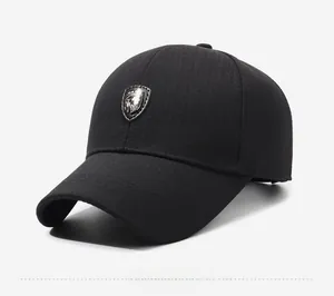 Detail view of the black cotton baseball cap showing the metallic shield lion logo
