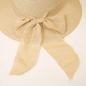 Close-up of the fine woven paper straw texture and large bow detail on this sun hat