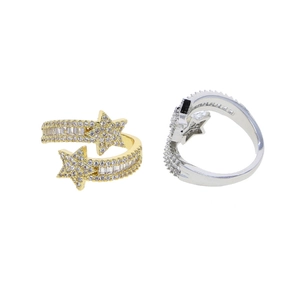 Close-up of gold and silver star rings with micro-pave cubic zirconia on white background