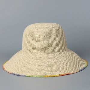 Detailed close-up of handmade woven sun hat featuring vibrant multi-colored rainbow brim edges