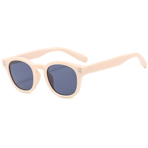 Retro round cream sunglasses with dark grey lenses and silver double rivet accents