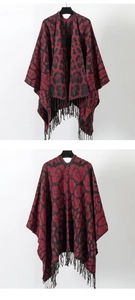 Front and back view of leopard print knit shawl with black fringe tassels on red fabric