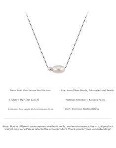 Detail of 925 sterling silver chain with a baroque pearl and silver bead pendant