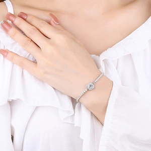 Elegant S925 sterling silver moissanite bracelet on woman wrist with sparkling diamonds