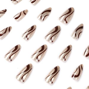 Brown wave pattern almond fake nails with golden glitter finish on white background