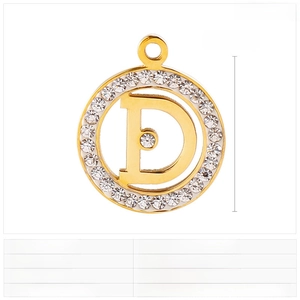 Macro detail of round stainless steel pendant with rhinestone halo and letter D