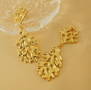 Close-up of 18K gold plated irregular lava leaf earrings with organic hollow structure