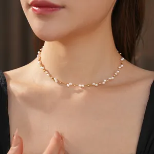 French vintage double-layered pearl choker necklace with gold beads on model neck