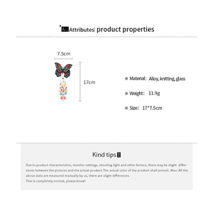 Detailed view of butterfly hair clip with blue knitted wings and colorful glass beads