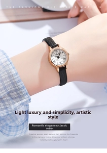 Close-up of minimalist rose gold watch with black leather strap on a female wrist
