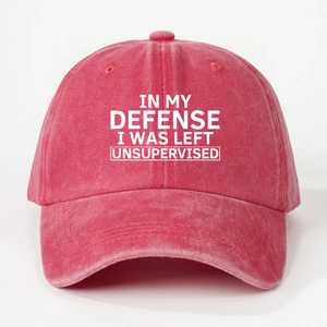 Detailed front view of a red washed cotton baseball cap with white printed text slogan
