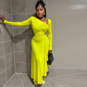 Detail of elegant slim fit pleated dress with asymmetric collar in neon green