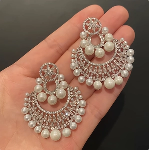 Elegant silver flower pearl earrings with sparkling rhinestones in a vintage floral design