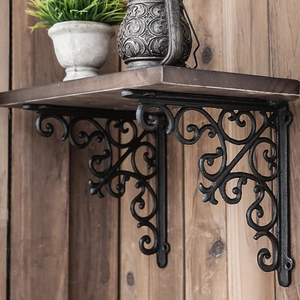 European vintage heavy duty cast iron shelf brackets with ornate decorative scrollwork pattern