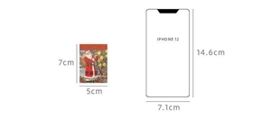 Size comparison of Christmas sticker next to iPhone 12 showing 7x5cm dimensions