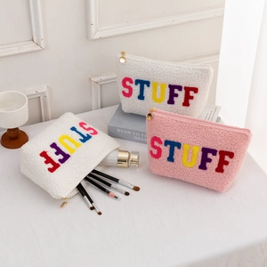 Large plush cosmetic bag with colorful chenille STUFF embroidery and gold zipper