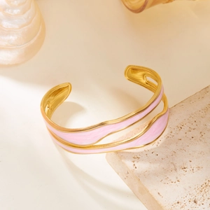 Elegant gold-plated stainless steel open bangle with pink enamel wavy double-layer design
