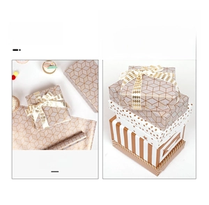 Detail of luxury gold foil gift wrap with geometric cubes and polka dot patterns