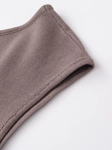 Detailed macro view showing the high-density knit fabric and precise edge stitching