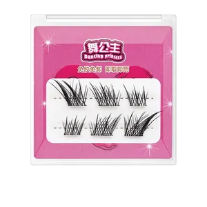 Close-up of portable self-adhesive false eyelashes in a pink heart-shaped compact case