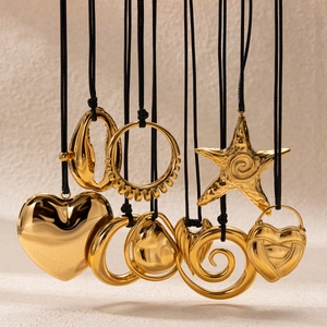 Minimalist gold stainless steel necklaces with various geometric pendants on black cords